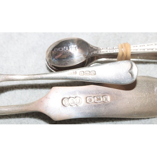 253 - A pair of London silver sugar tongs, a pair of Sheffield silver sugar tongs and 2 silver butter kniv... 