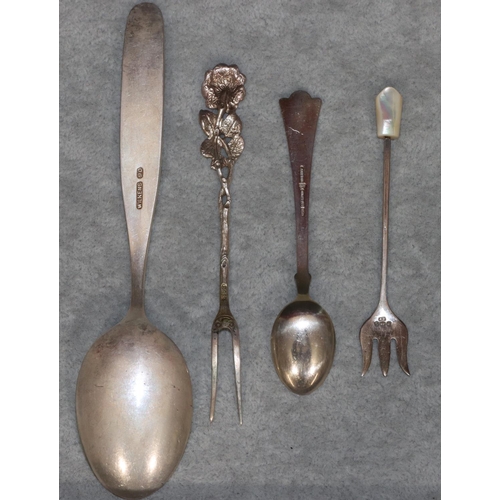 255 - A Norwegian sterling silver and white enamelled teaspoon, a Wilkens 900 silver coloured metal spoon ... 