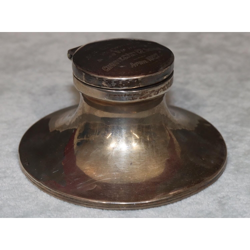 257 - A Birmingham silver round inkstand with hinged lid with engraved presentation, enclosing glass liner... 