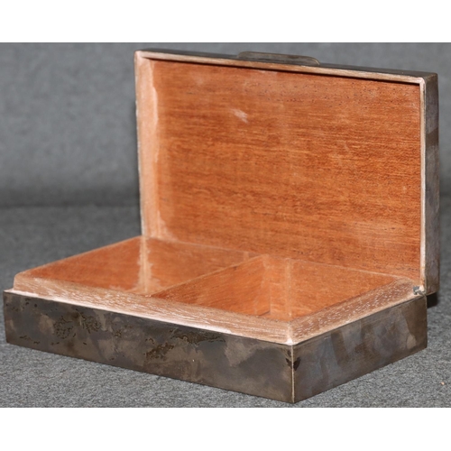 265 - A Birmingham silver rectangular shaped cigarette box with engine turned hinged lid enclosing cedar l... 