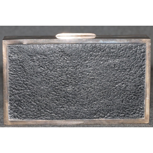 265 - A Birmingham silver rectangular shaped cigarette box with engine turned hinged lid enclosing cedar l... 