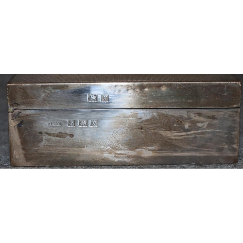 265 - A Birmingham silver rectangular shaped cigarette box with engine turned hinged lid enclosing cedar l... 