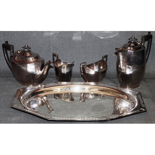 276 - A silver plated chamfered tray with pierced rim on bun feet, 40.5cm wide and a silver plated 4-piece... 