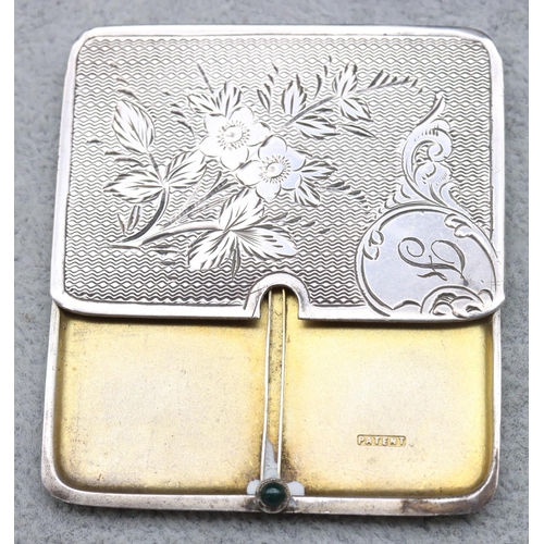 288 - A silver flat 2-sectioned sliding stamp box with engine turned, floral and leaf decorated cover and ... 