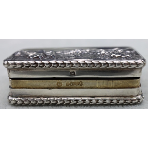 300 - A London silver small rectangular shaped snuff box with embossed figure decorated hinged lid, 5.7cm ... 