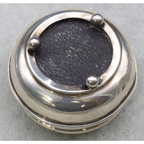 304 - A Birmingham silver round bulbous shaped trinket box with hinged lid enclosing silk interior on 3 ba... 