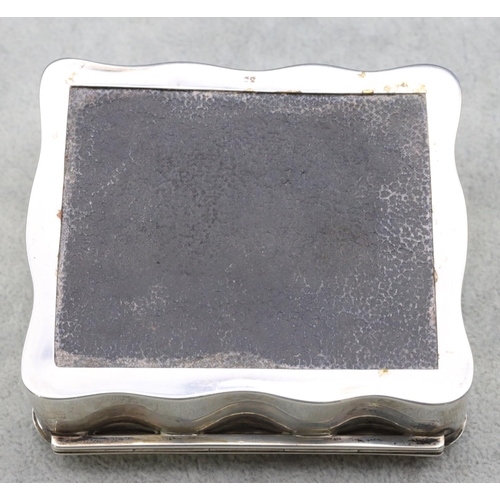 308 - A Birmingham silver rectangular scallop shaped trinket box with hinged lid enclosing cream silk inte... 