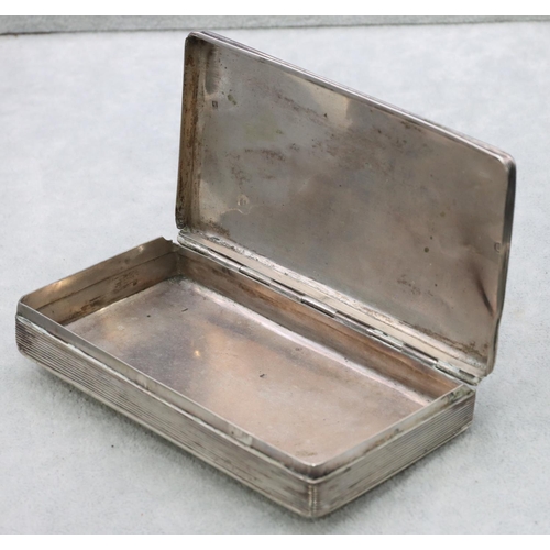 309 - A Continental silver coloured metal rectangular tobacco box with engine turned hinged lid, 13cm long... 