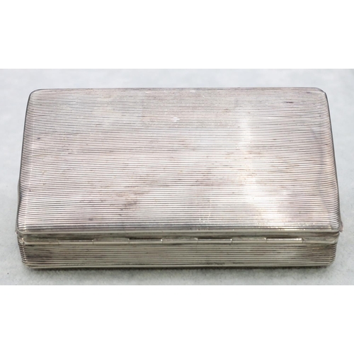 309 - A Continental silver coloured metal rectangular tobacco box with engine turned hinged lid, 13cm long... 