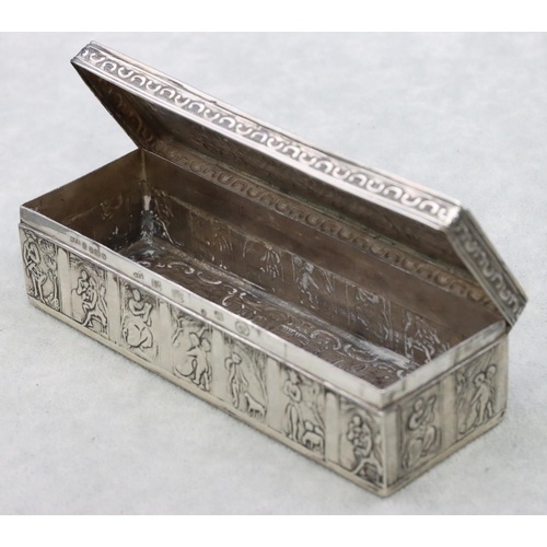 310 - A Continental silver imported rectangular shaped box with hinged lid and allover embossed figure, cu... 