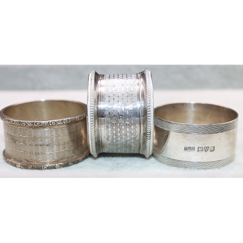 317 - 2 Birmingham silver round napkin rings with engine turned decoration and a Chester silver napkin rin... 