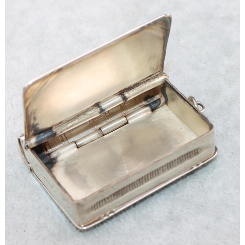 323 - A modern 925 silver novelty vesta/stamp case in the form of a book with double hinged sides and engr... 