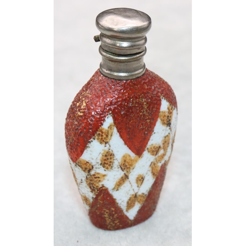 325 - A china and silver topped scent bottle with hinged lid on white and red ground with leaf decoration,... 