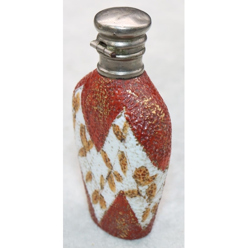 325 - A china and silver topped scent bottle with hinged lid on white and red ground with leaf decoration,... 