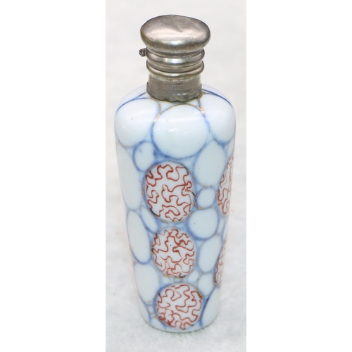 326 - A china round scent bottle with silver hinged lid on white, red and blue ground, 8.2cm high