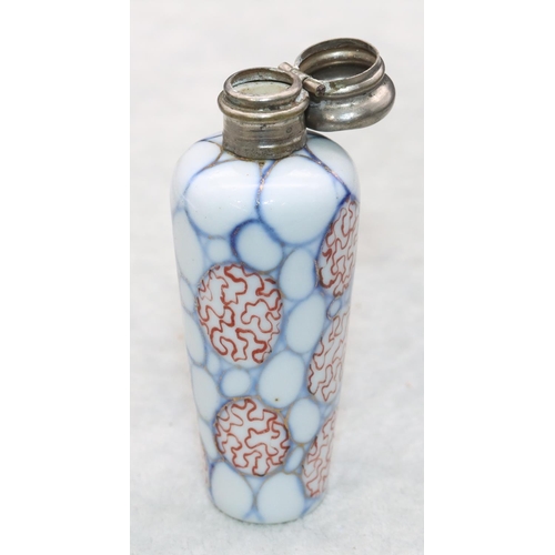 326 - A china round scent bottle with silver hinged lid on white, red and blue ground, 8.2cm high