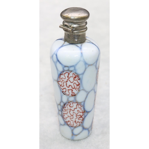 326 - A china round scent bottle with silver hinged lid on white, red and blue ground, 8.2cm high