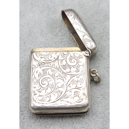 342 - An Edward VII silver vesta case with chased scroll and leaf decoration and hinged lid, Birmingham 19... 