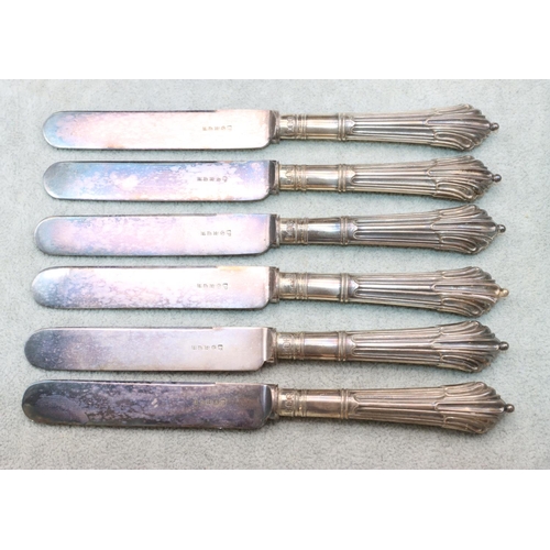 351 - A set of 6 silver handled butter knives with reeded decoration, in fitted black leather case