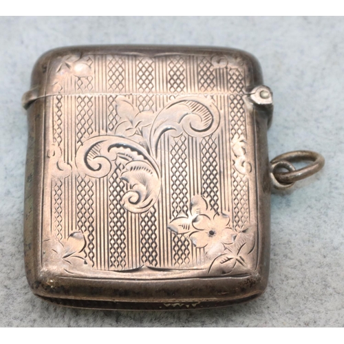 365 - A silver vesta case with shield motif and chased scroll decoration and hinged lid, Birmingham 1901 (... 