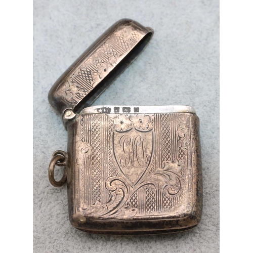 365 - A silver vesta case with shield motif and chased scroll decoration and hinged lid, Birmingham 1901 (... 