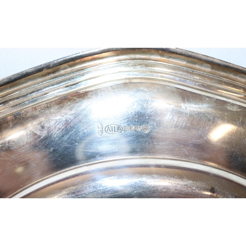 368 - An 830 silver coloured metal round bulbous shaped hand bell with embossed floral and scroll decorati... 