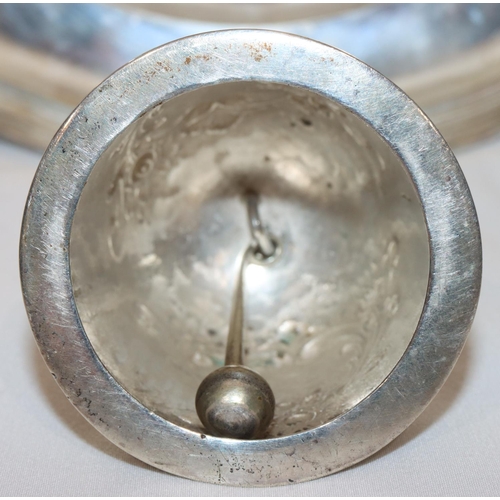 368 - An 830 silver coloured metal round bulbous shaped hand bell with embossed floral and scroll decorati... 