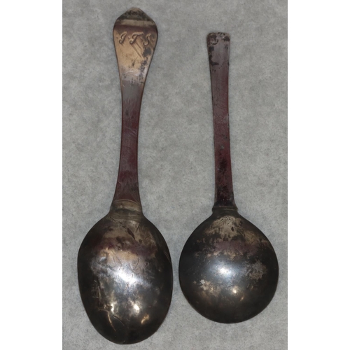 371 - An antique Danish silver marriage spoon with chased decoration and a similar silver coloured metal s... 