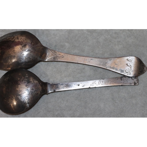 371 - An antique Danish silver marriage spoon with chased decoration and a similar silver coloured metal s... 