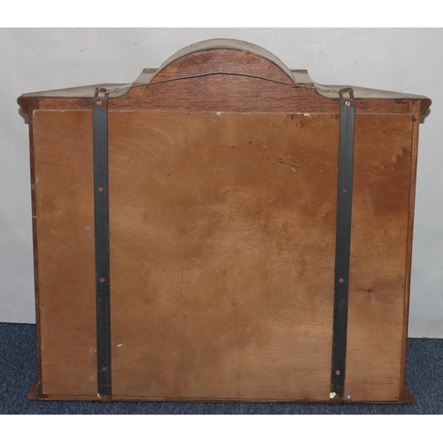 728 - A walnut hanging cabinet with arched top, astragal glazed door flanked by glass sides enclosing shap... 