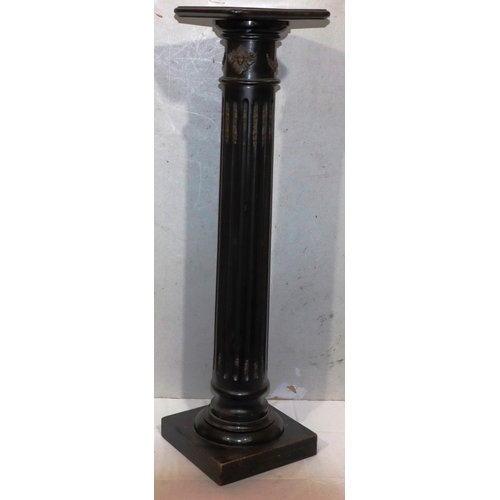 729 - An ebonised square topped torchiere on Corinthian column support with fluted decoration and raised g... 