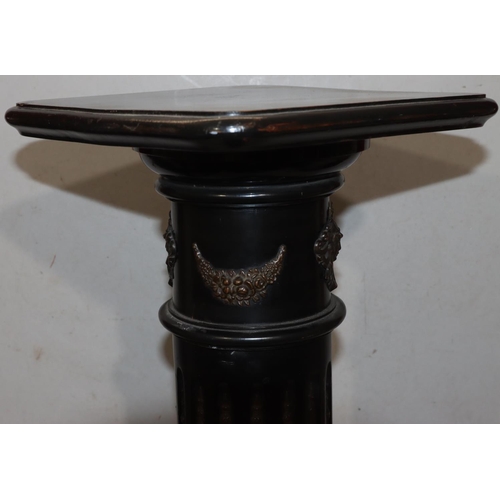 729 - An ebonised square topped torchiere on Corinthian column support with fluted decoration and raised g... 