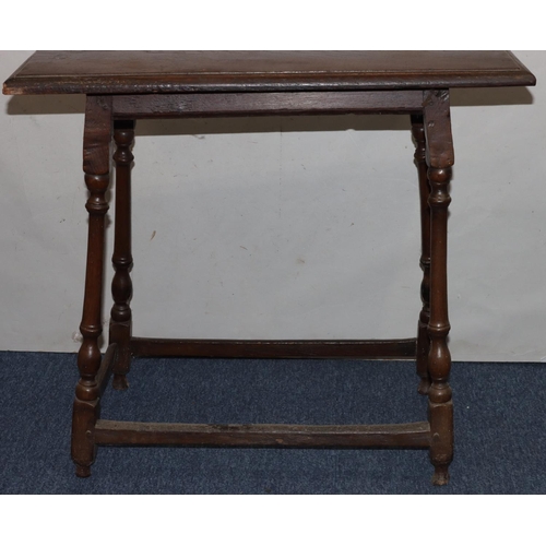 735 - An 18th Century oak rectangular shaped occasional table on turned legs with stretchers (top altered)... 