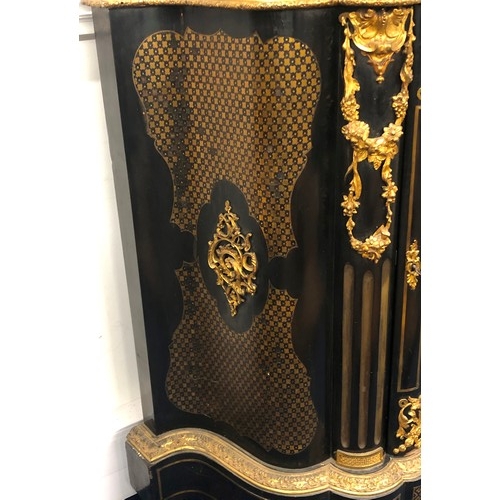 742 - A 19th Century ebonised and Ormolu Serpentine fronted side cabinet with allover raised floral, swag,... 