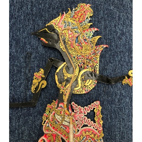 2357 - A Indonesian shadow puppet, 74.5cm high from base of handle to top of head, working condition