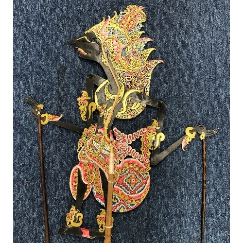 2357 - A Indonesian shadow puppet, 74.5cm high from base of handle to top of head, working condition