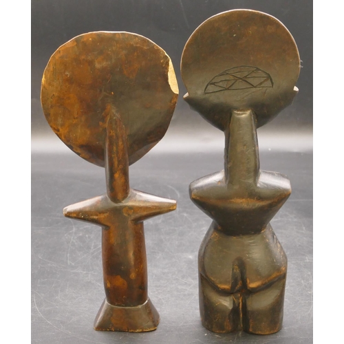 666 - 2 early African carved wooden figures, 28cm and 25cm high (chip to back rim of 1) (2)