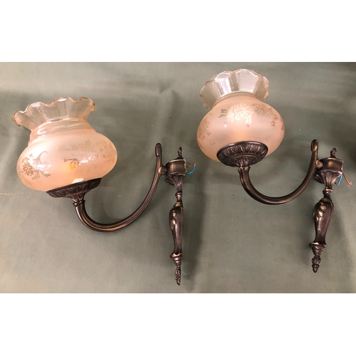 2174 - A pair of metallic wall lights with frosted glass shades, wall fitting 22cm long, another metallic a... 