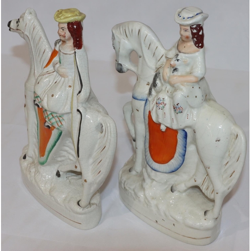 85 - 2 19th Century Staffordshire groups of young girls seated on horses, 27cm high (crackle wear to back... 