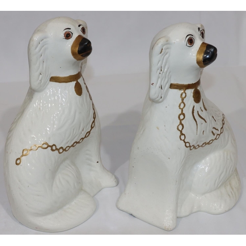 91 - A pair of 19th Century Staffordshire figures of seated spaniels with gilt chains and painted eyes, 3... 