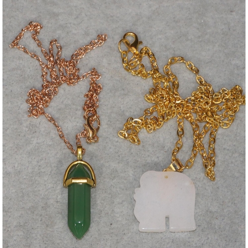 455 - A green hardstone drop pendant with chain and a white hardstone pendant in the form of an elephant w... 