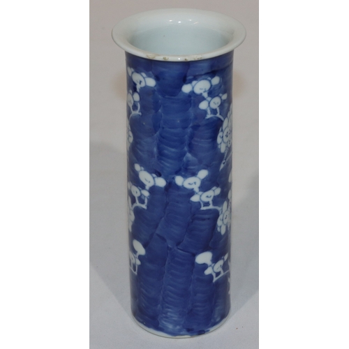 113 - A 19th Century Chinese cylindrical trumpet shaped vase on blue and white ground with branch and blos... 