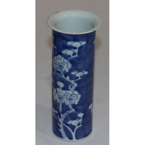 113 - A 19th Century Chinese cylindrical trumpet shaped vase on blue and white ground with branch and blos... 