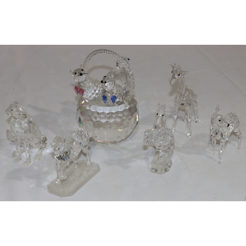 18 - A Swarovski basket mounted with 3 cats (2 ears missing), 14.5cm high and 5 other Swarovski figures o... 