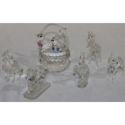 18 - A Swarovski basket mounted with 3 cats (2 ears missing), 14.5cm high and 5 other Swarovski figures o... 