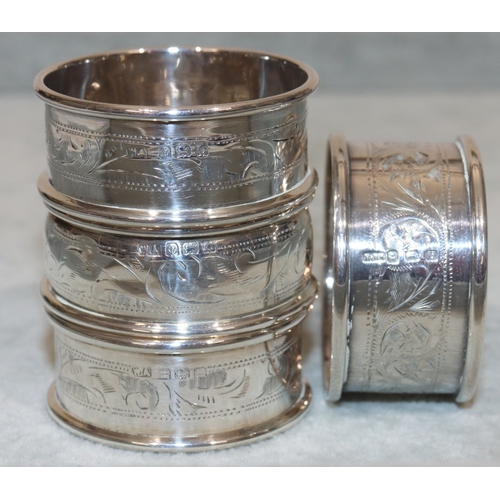 180 - A pair of Birmingham silver round napkin rings and 2 further napkin rings (3), 1oz, with odd leather... 