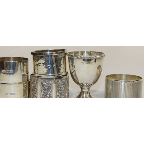 198 - 4 various silver round napkin rings, an Eastern silver coloured metal napkin ring and a Birmingham s... 