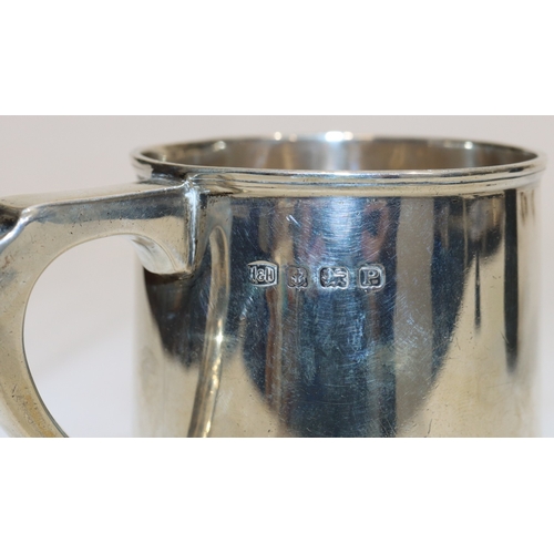 201 - A Birmingham plain silver christening mug with scroll handle, engraved monogram, maker's mark H&H, 8... 