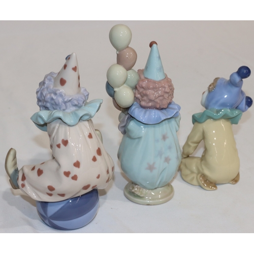 22 - 2 Lladro figurines of clowns, 18cm high and a similar Nao figure (3)