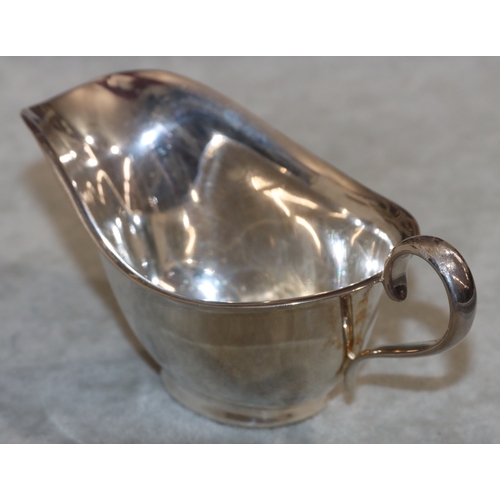 224 - A silver small sauceboat with scroll handle, Sheffield 1944, 3.1oz